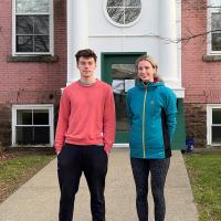 Two college interns in front of Vermont Legal Aid office