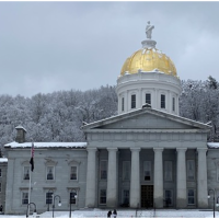 Vermont State Capital Building in winter with snow.
